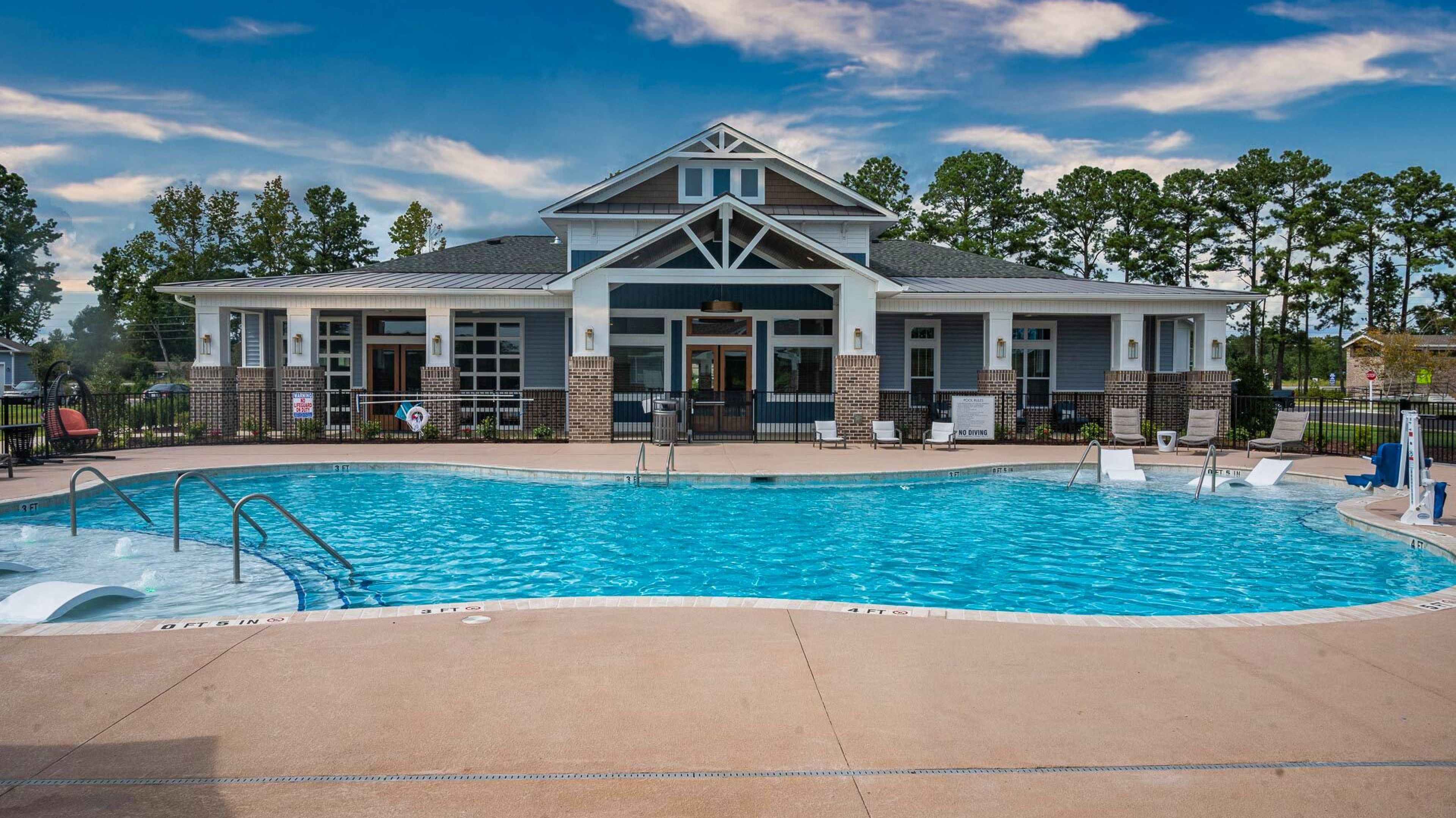 Hawthorne Waterside inviting outdoor pool area featuring ample lounging space, and a covered pavilion.